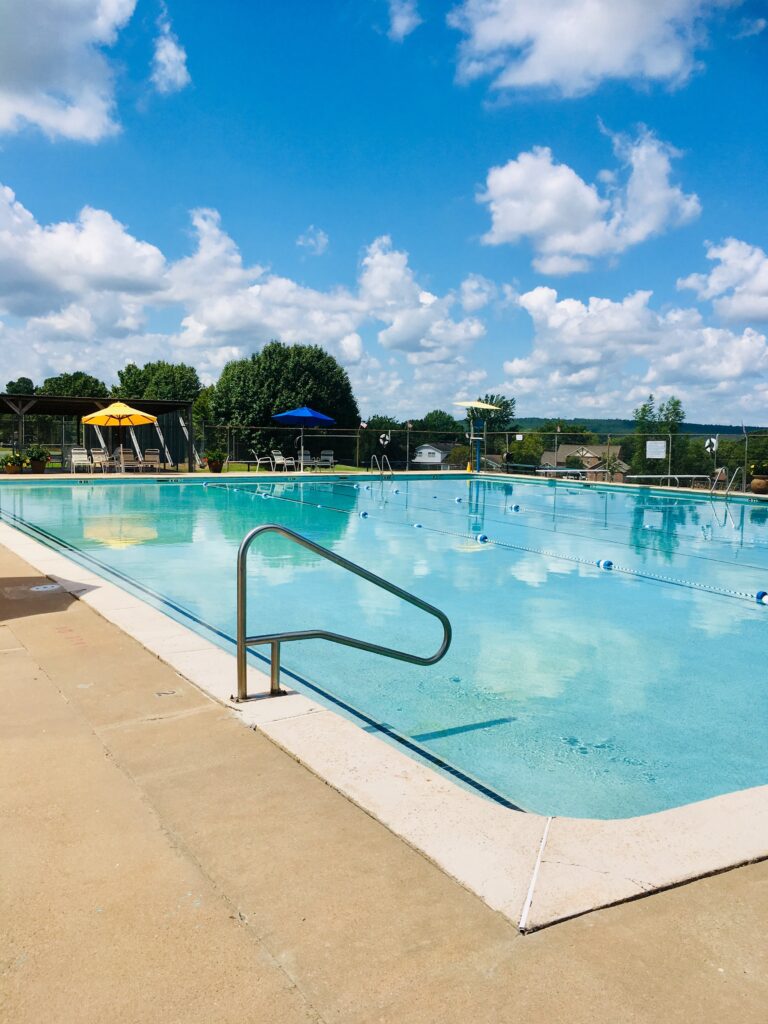 The olympic-size swimming pool at McAlester Country Club on a clear day
