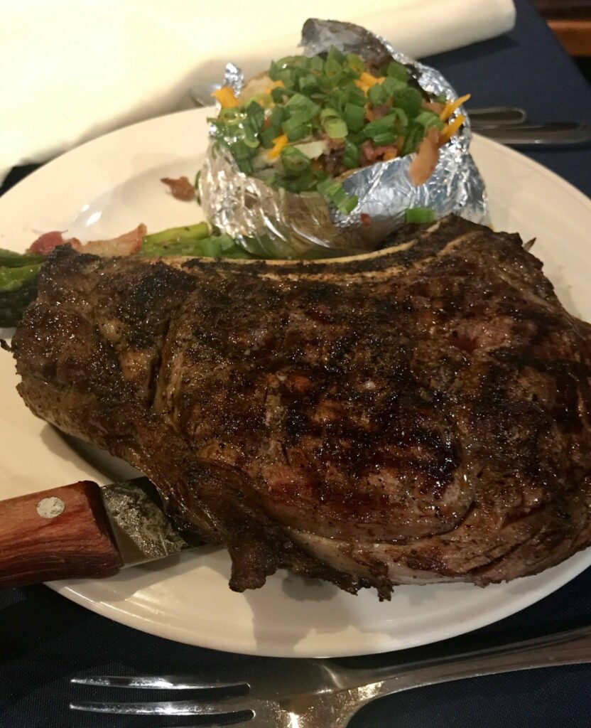 A steak dinner plated in the dining room at McAlester Country Club